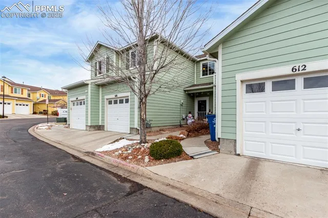 a front view of a house with a garage