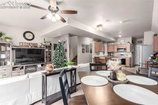 a kitchen with a table chairs and a stove