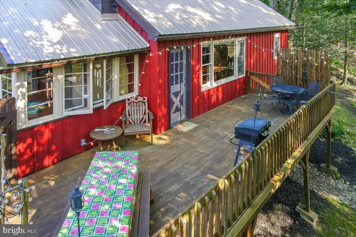 112 Beechwood Cove Road Greentown, PA 18426 - Photo 4 of 59 a view of balcony with two chairs and wooden fence