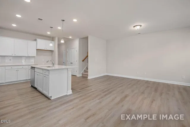 a view of kitchen with wooden floor
