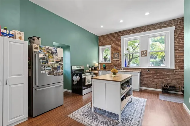 a living room with fireplace furniture and a flat screen tv