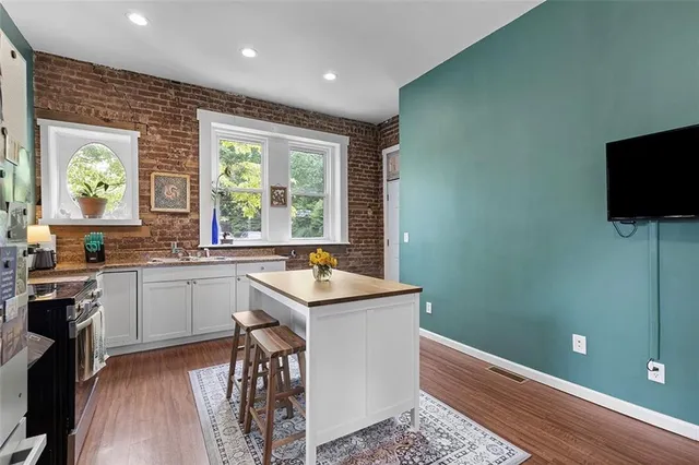 a view of a livingroom with furniture and a fireplace
