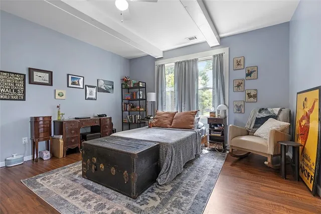 a view of hallway with wooden floor