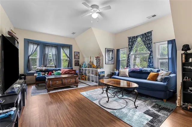 a kitchen with stainless steel appliances granite countertop a refrigerator sink and stove