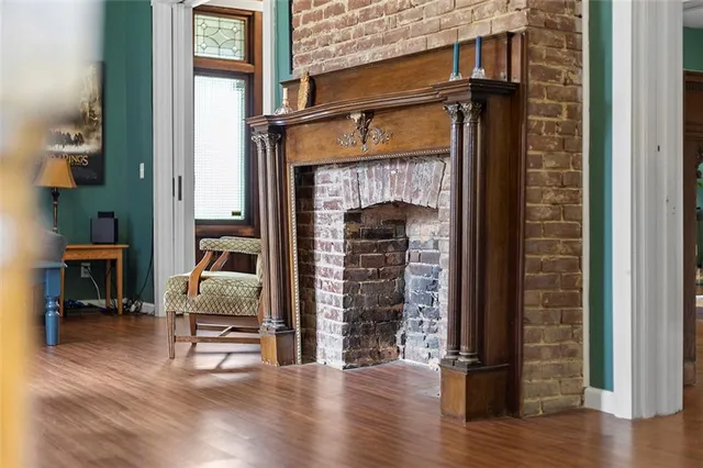 a view of living room and wooden floor