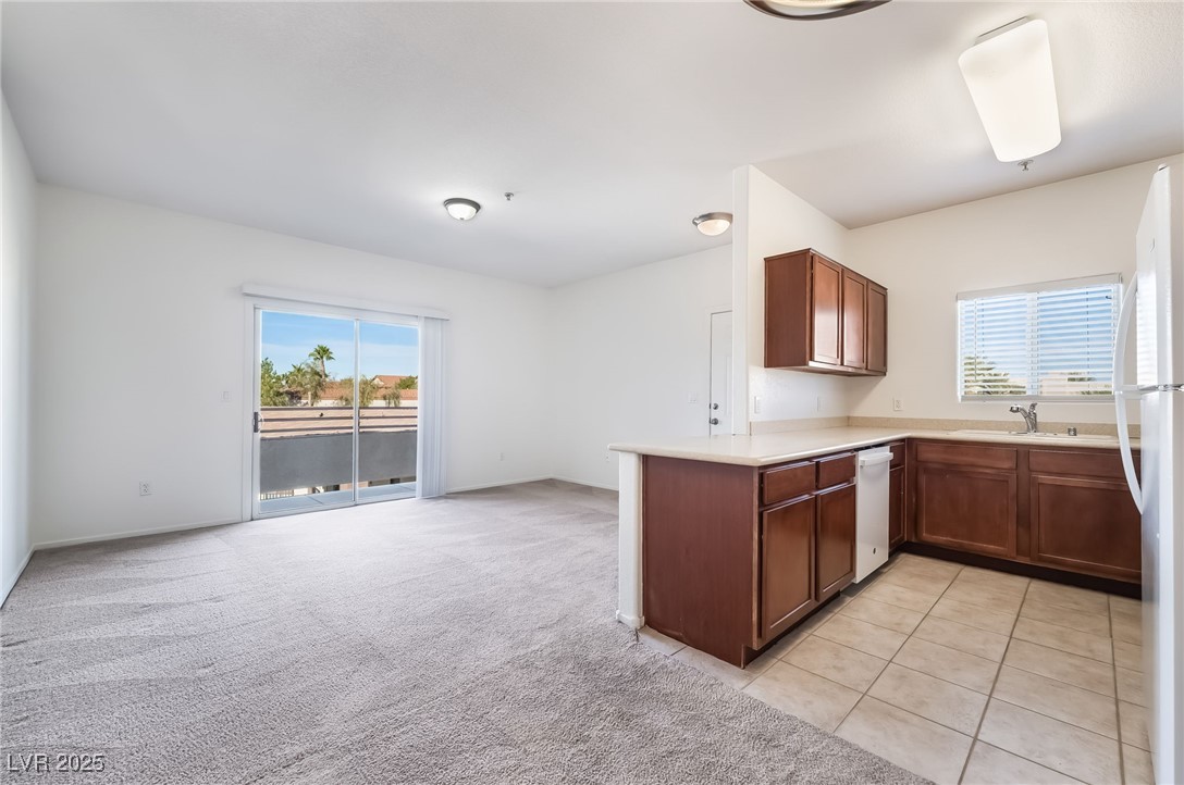 2291 West Horizon Ridge Parkway, Unit 12270 Henderson, NV 89052 - Photo 15 of 33 Kitchen featuring new appliances & solid surface counters