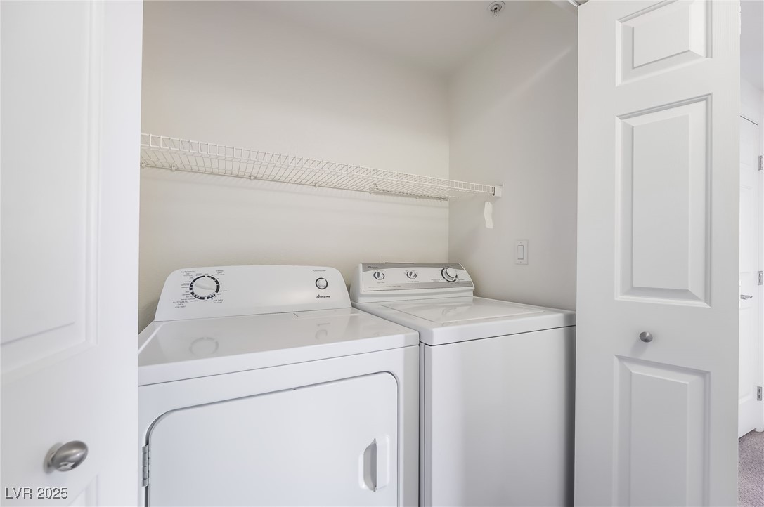 2291 West Horizon Ridge Parkway, Unit 12270 Henderson, NV 89052 - Photo 32 of 33 Laundry area with washing machine and dryer