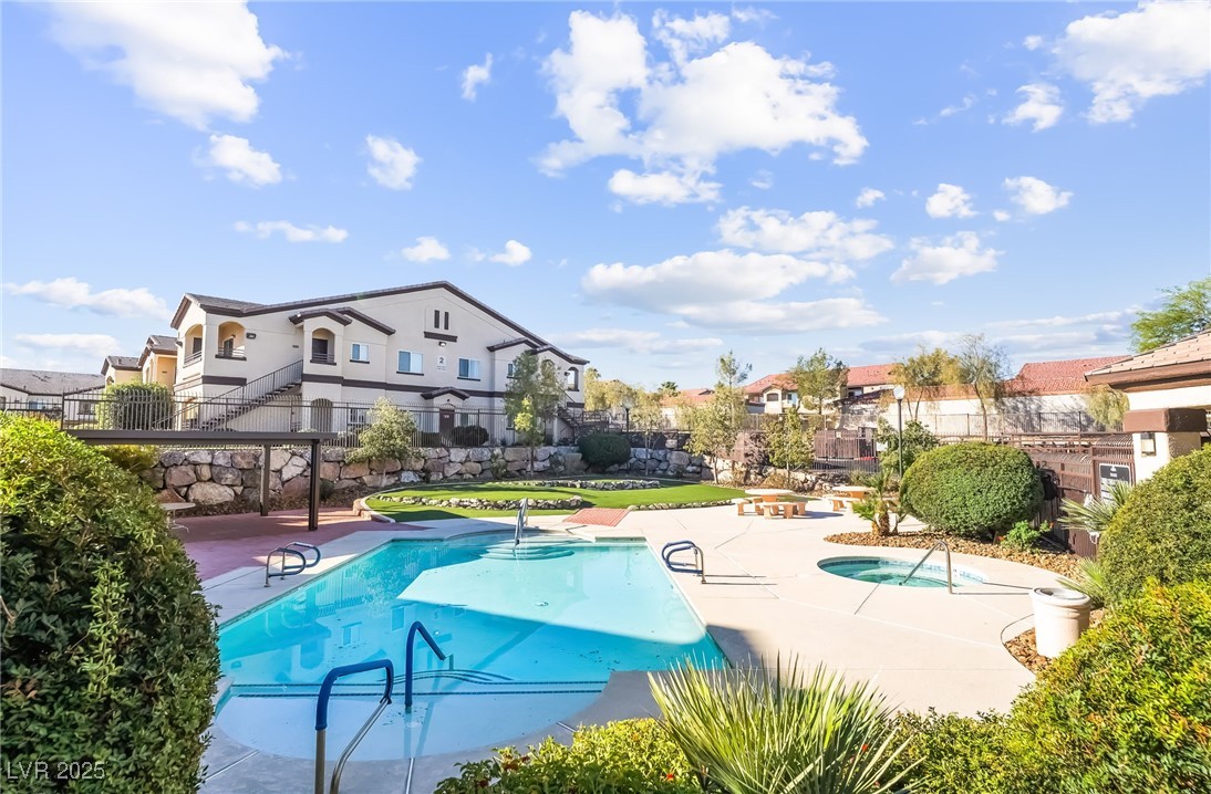 2291 West Horizon Ridge Parkway, Unit 12270 Henderson, NV 89052 - Photo 4 of 33 Community pool with a patio area, a residential view, and a community hot tub