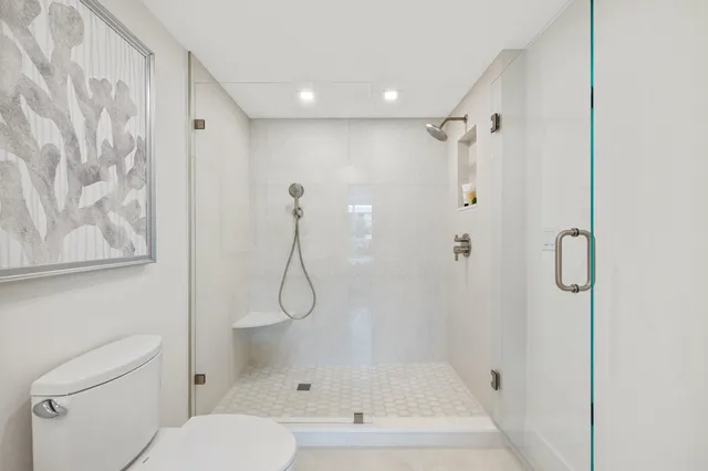 a bathroom with a bathtub and a shower