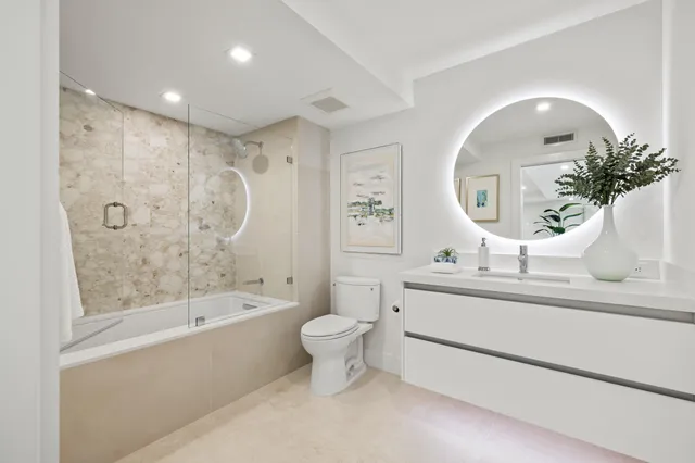 a bedroom with a bed and walk in closet