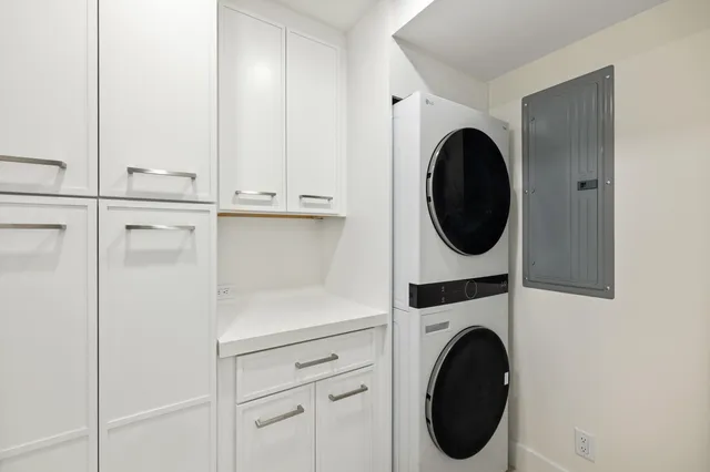 a swimming pool with outdoor seating and city view