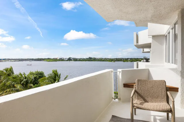 a balcony with palm trees