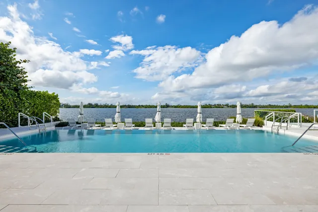 a view of a living room kitchen and a wooden floor