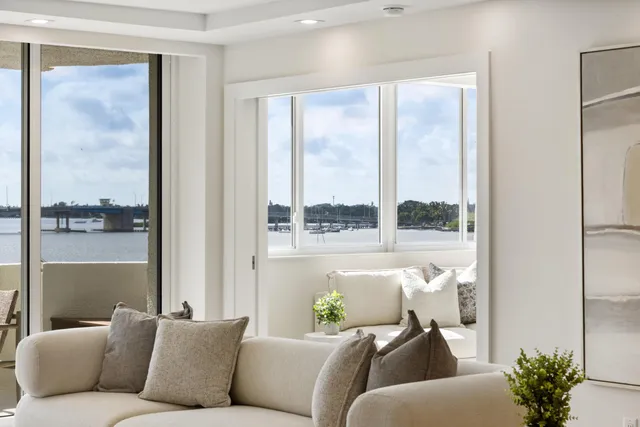 a kitchen with stainless steel appliances granite countertop a sink a stove and a refrigerator