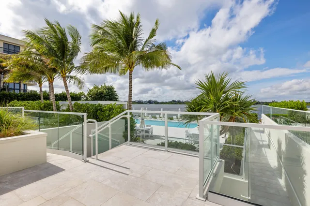 a kitchen with stainless steel appliances and white cabinets