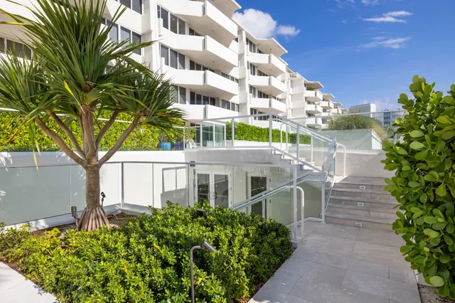 a view of a room with gym equipment and a large window