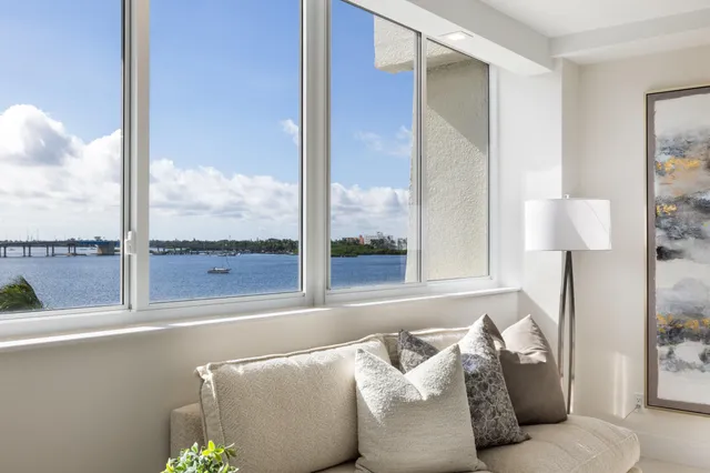 a bathroom with a granite countertop sink mirror a toilet and a shower