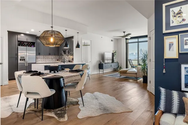 a view of a dining room with furniture window and wooden floor