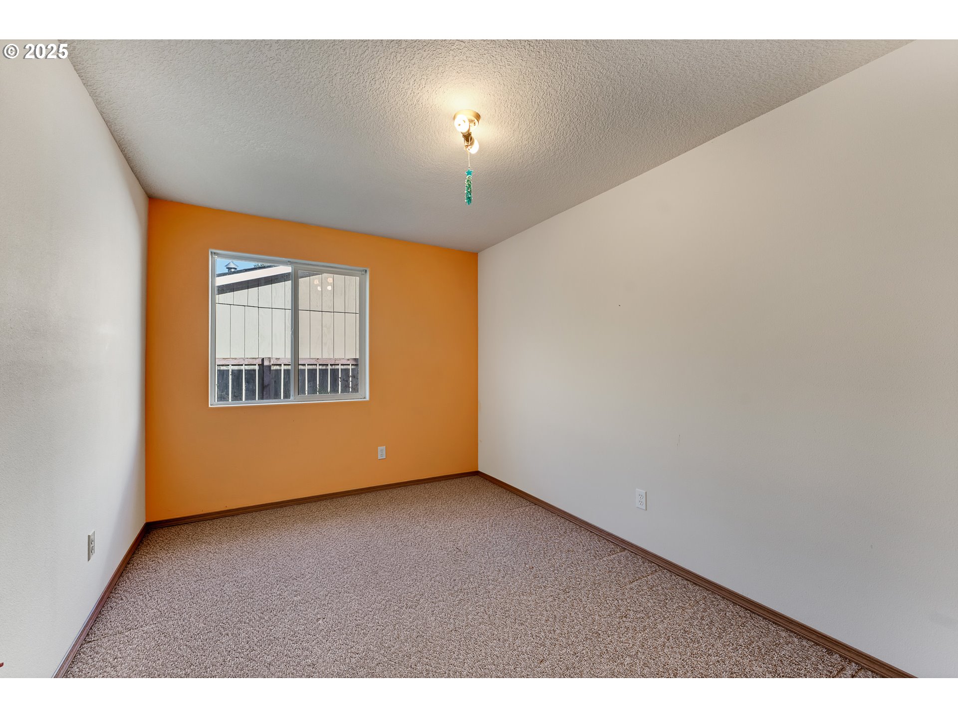 34130 Pintail Avenue Nehalem, OR 97131 - Photo 13 of 25 a view of an empty room with a window