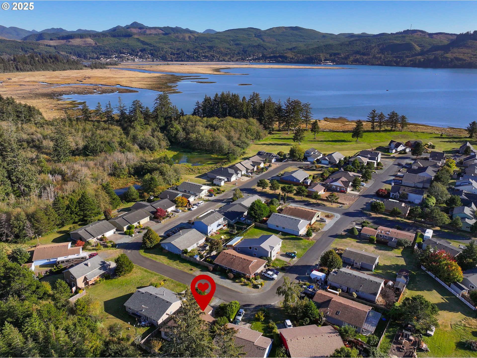 34130 Pintail Avenue Nehalem, OR 97131 - Photo 3 of 25 a view of a city with lake view