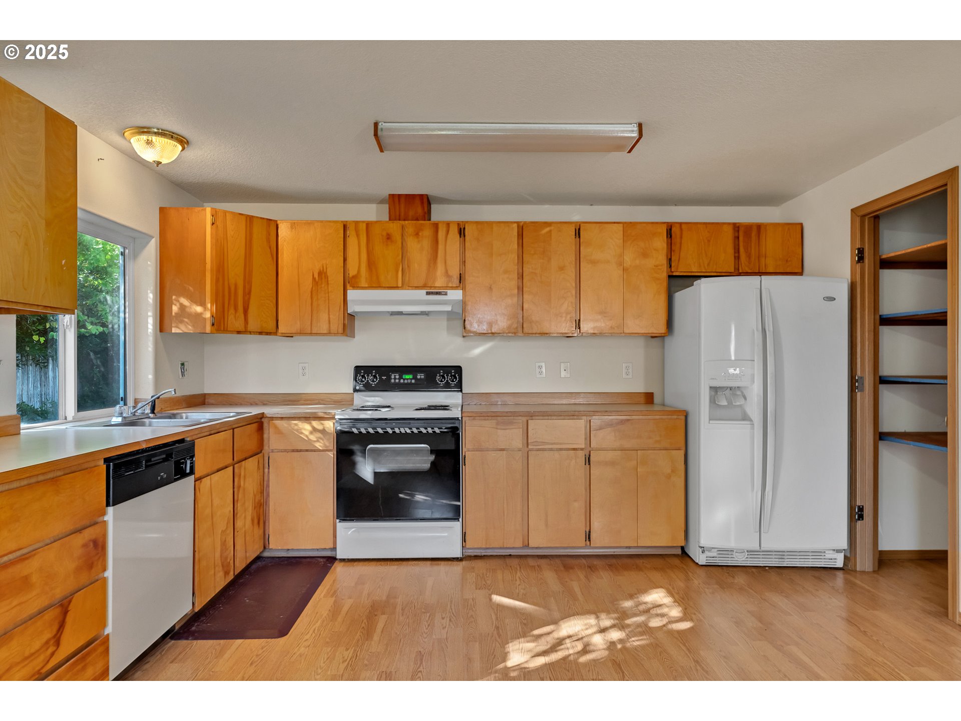 34130 Pintail Avenue Nehalem, OR 97131 - Photo 8 of 25 a kitchen with a refrigerator and a sink