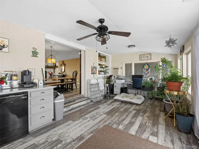 a bedroom with furniture and wooden floor