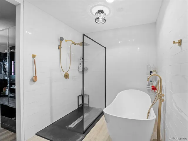 a bathroom with a bathtub and a sink