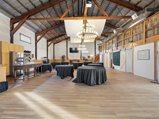 a view of a living room and kitchen with furniture