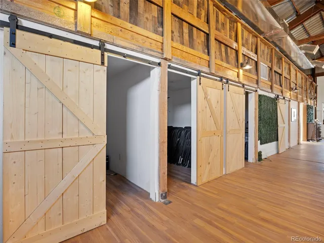a view of a livingroom with furniture and a flat screen tv