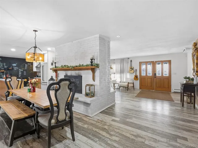 a kitchen filled with stainless steel appliances granite countertop a refrigerator a sink and a stove top oven