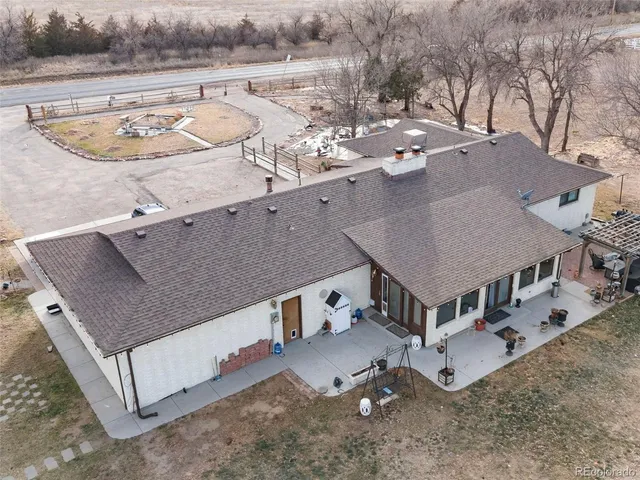 a kitchen with stainless steel appliances granite countertop a stove a refrigerator and a white cabinets