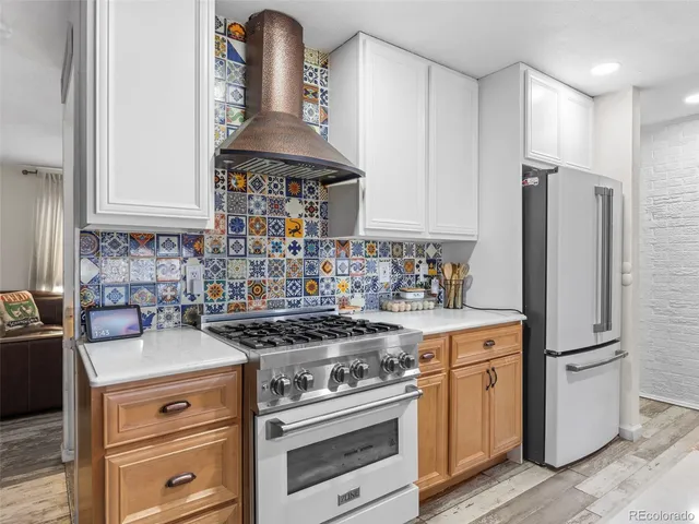 a kitchen with granite countertop a stove and a sink