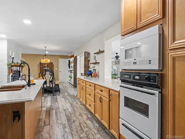 a view of a dining room with furniture and a chandelier