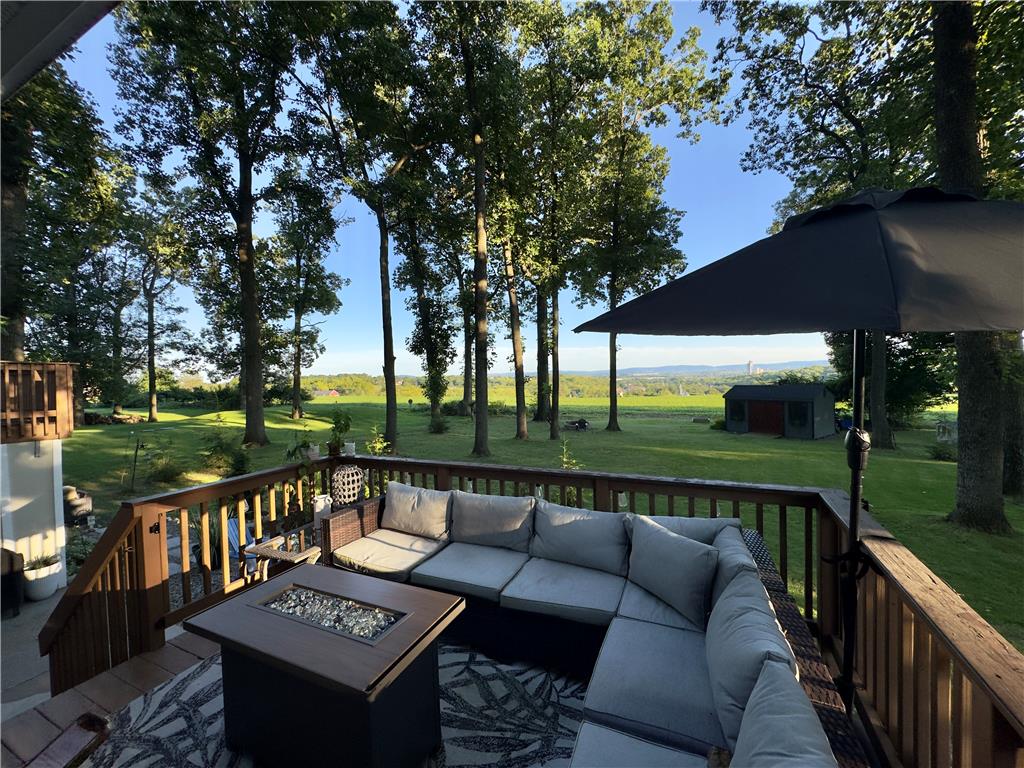 2569 Woods Edge Road Bath, PA 18014 - Photo 39 of 40 Rolling hills and mature trees frame the elevated wooden deck overlooking the lush lawn.