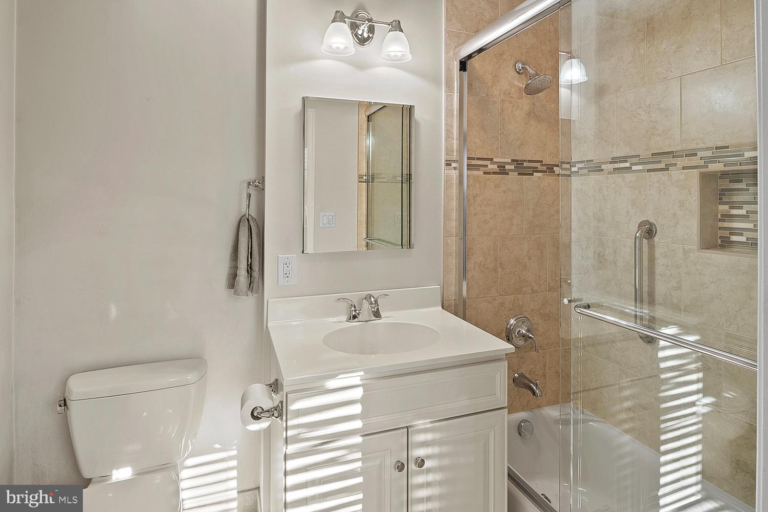 1002 Dennis Avenue Silver Spring, MD 20901 - Photo 18 of 37 a bathroom with a sink a toilet and shower