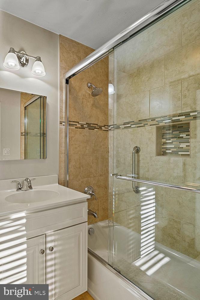 1002 Dennis Avenue Silver Spring, MD 20901 - Photo 19 of 37 a bathroom with a sink and a mirror