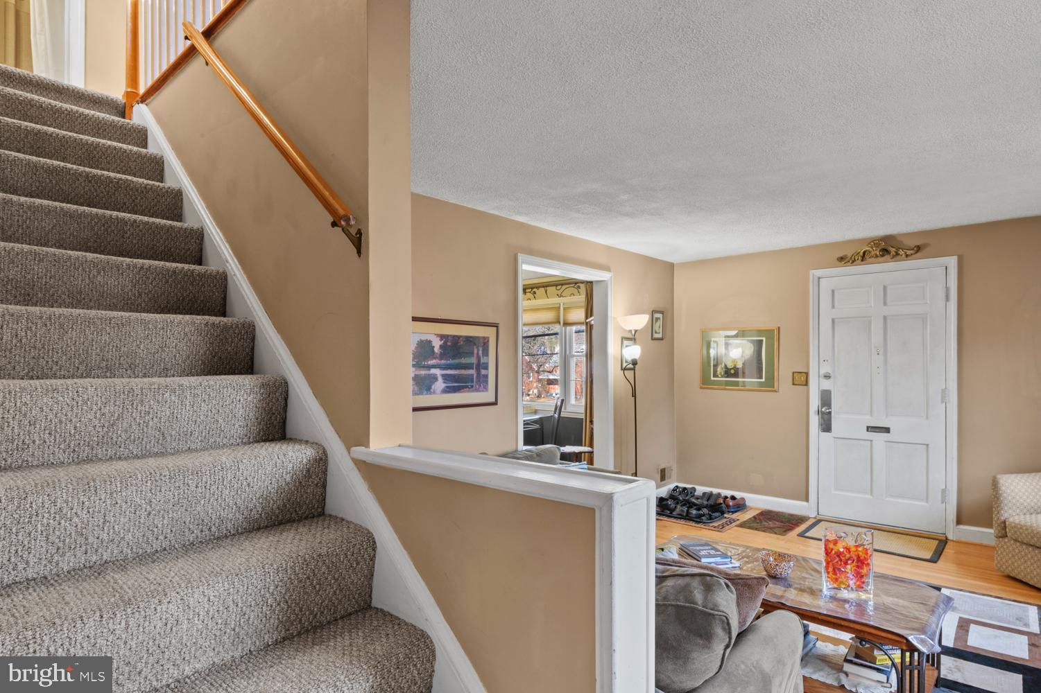 1002 Dennis Avenue Silver Spring, MD 20901 - Photo 20 of 37 a living room with furniture and stairs