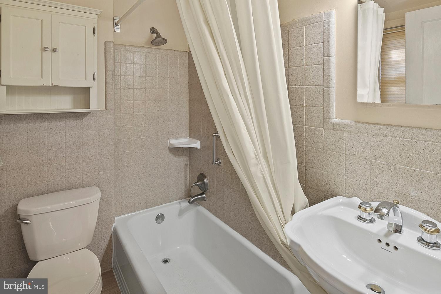 1002 Dennis Avenue Silver Spring, MD 20901 - Photo 26 of 37 a bathroom with a sink and toilet
