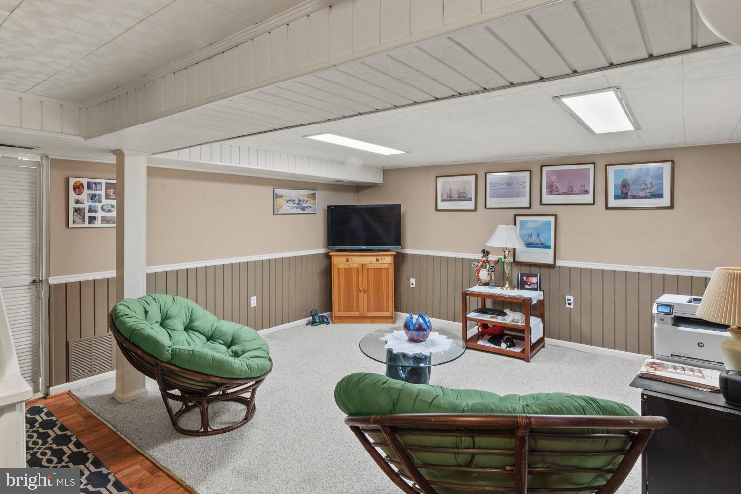 1002 Dennis Avenue Silver Spring, MD 20901 - Photo 28 of 37 a living room with furniture and a wooden floor
