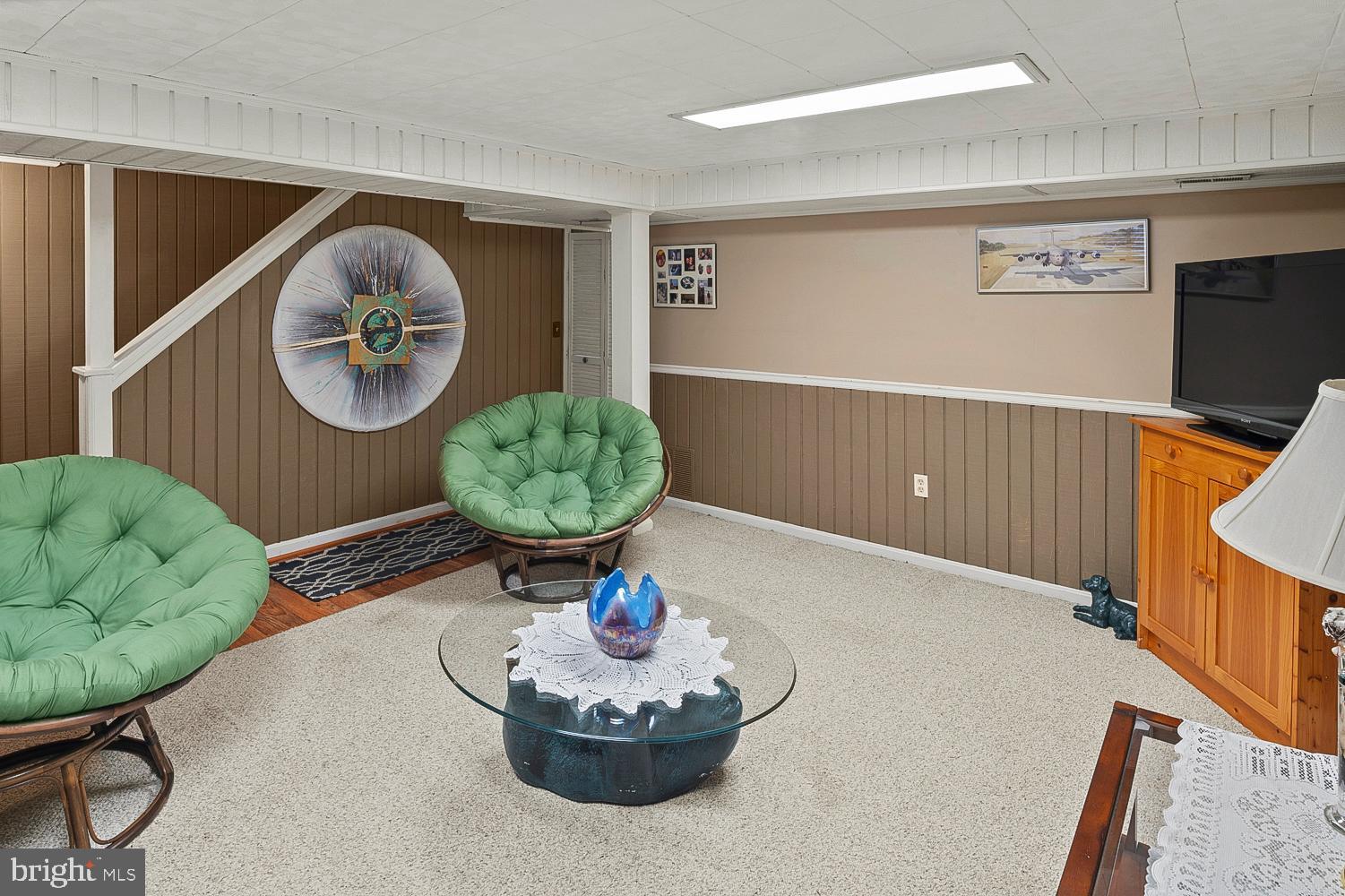 1002 Dennis Avenue Silver Spring, MD 20901 - Photo 30 of 37 a living room with furniture and a wooden floor