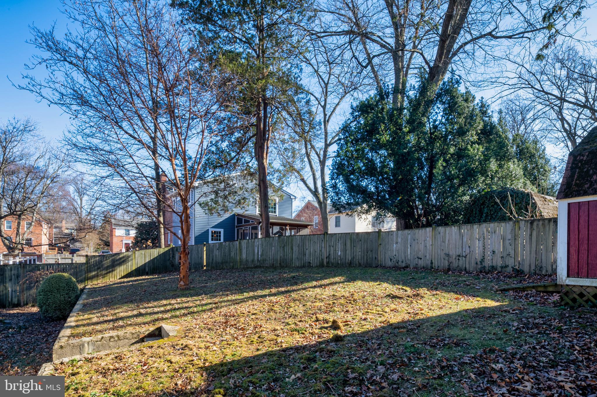 1002 Dennis Avenue Silver Spring, MD 20901 - Photo 35 of 37 a view of backyard with wooden fence and large trees