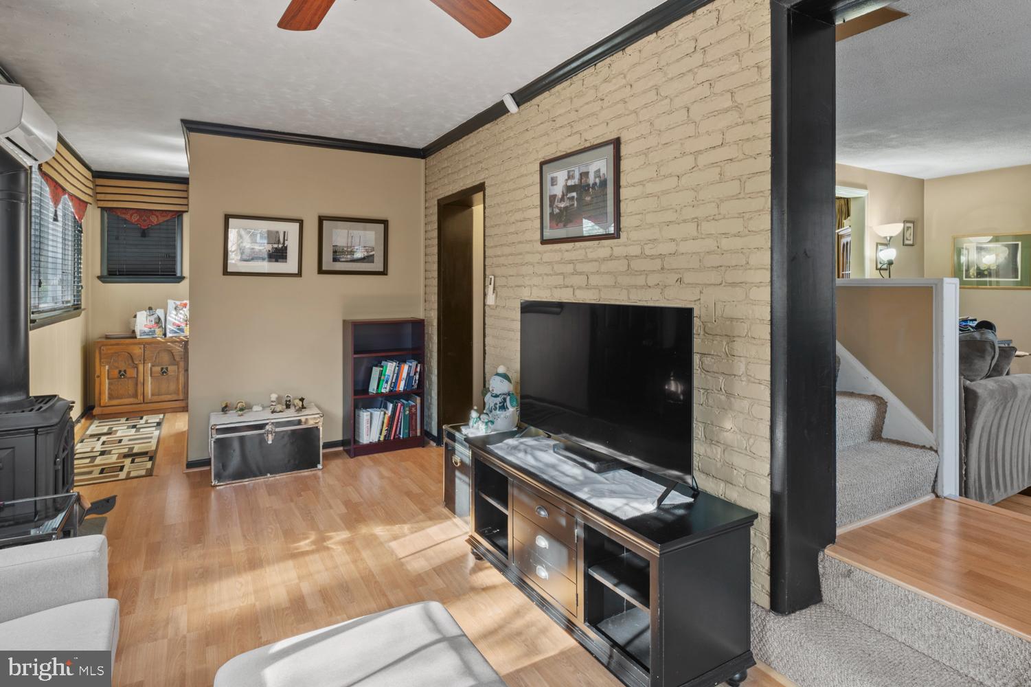 1002 Dennis Avenue Silver Spring, MD 20901 - Photo 10 of 37 a living room with furniture and a fireplace