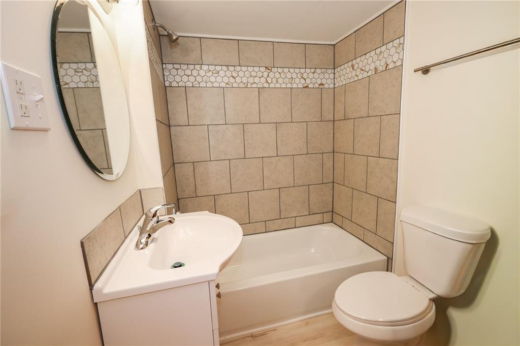 224 Boyers Road Harrisville, PA 16038 - Photo 18 of 28 a bathroom with a sink a toilet and shower