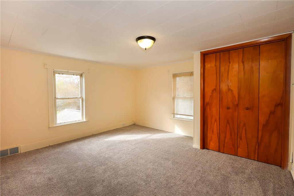 224 Boyers Road Harrisville, PA 16038 - Photo 19 of 28 an empty room with windows and closet