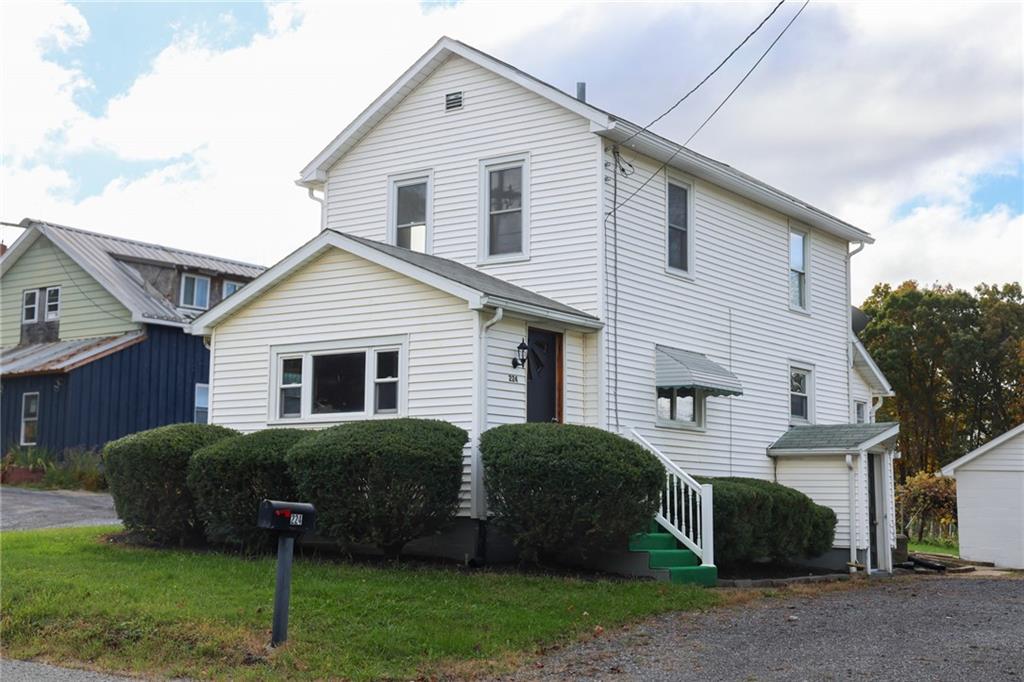 224 Boyers Road Harrisville, PA 16038 - Photo 2 of 28 a view of a house with a yard and a large tree front of house