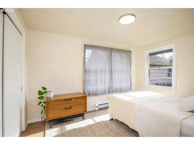 a bathroom with a granite countertop sink and a large mirror