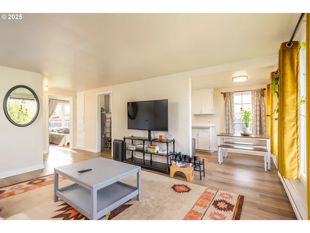 a kitchen with a sink a stove and cabinets