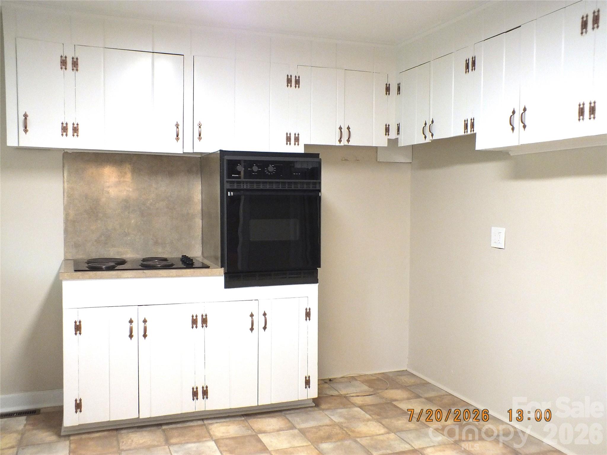 414 West Springs Street Lancaster, SC 29720 - Photo 9 of 22 a kitchen with stainless steel appliances cabinets and wooden floor