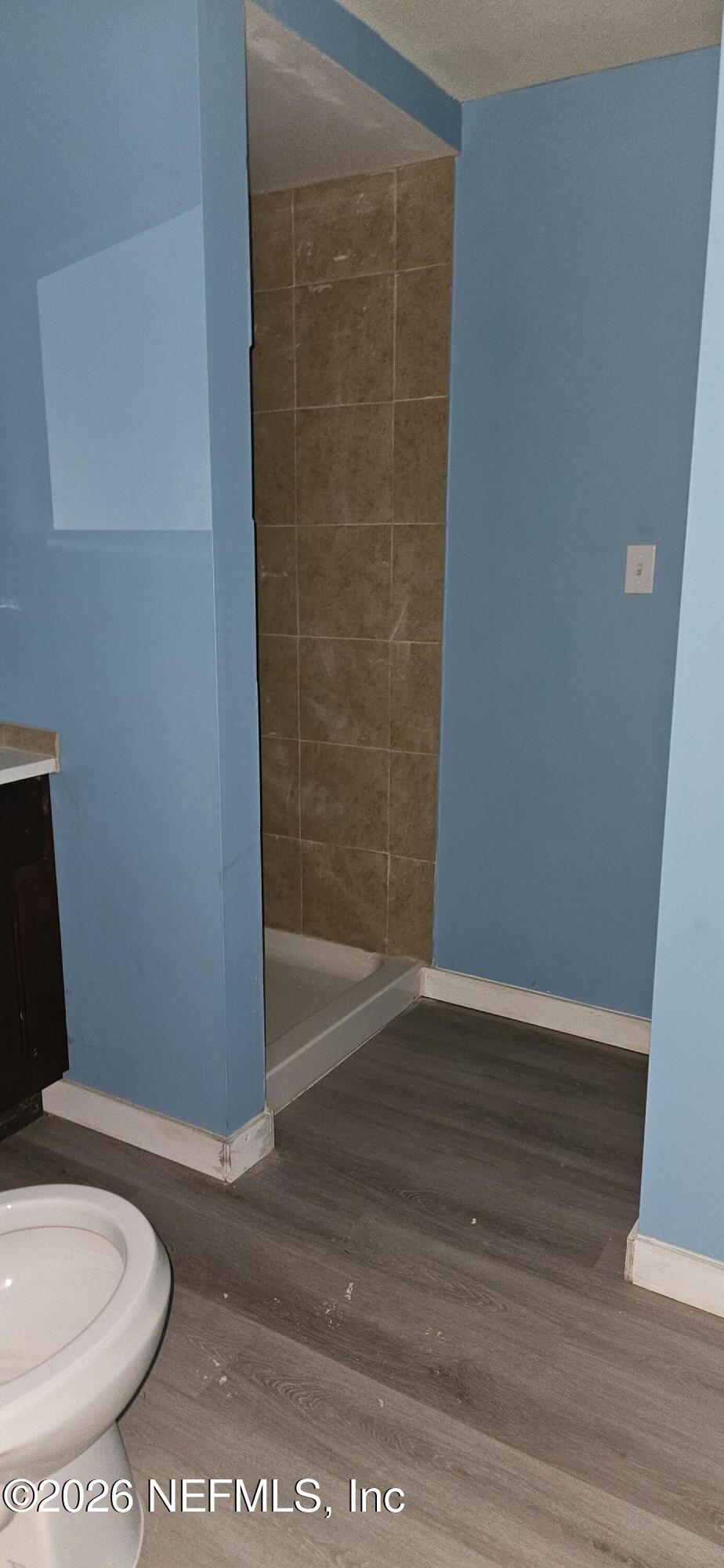 5363 Kilcrease Road Jacksonville, FL 32234 - Photo 18 of 29 a bathroom with a toilet and a rug