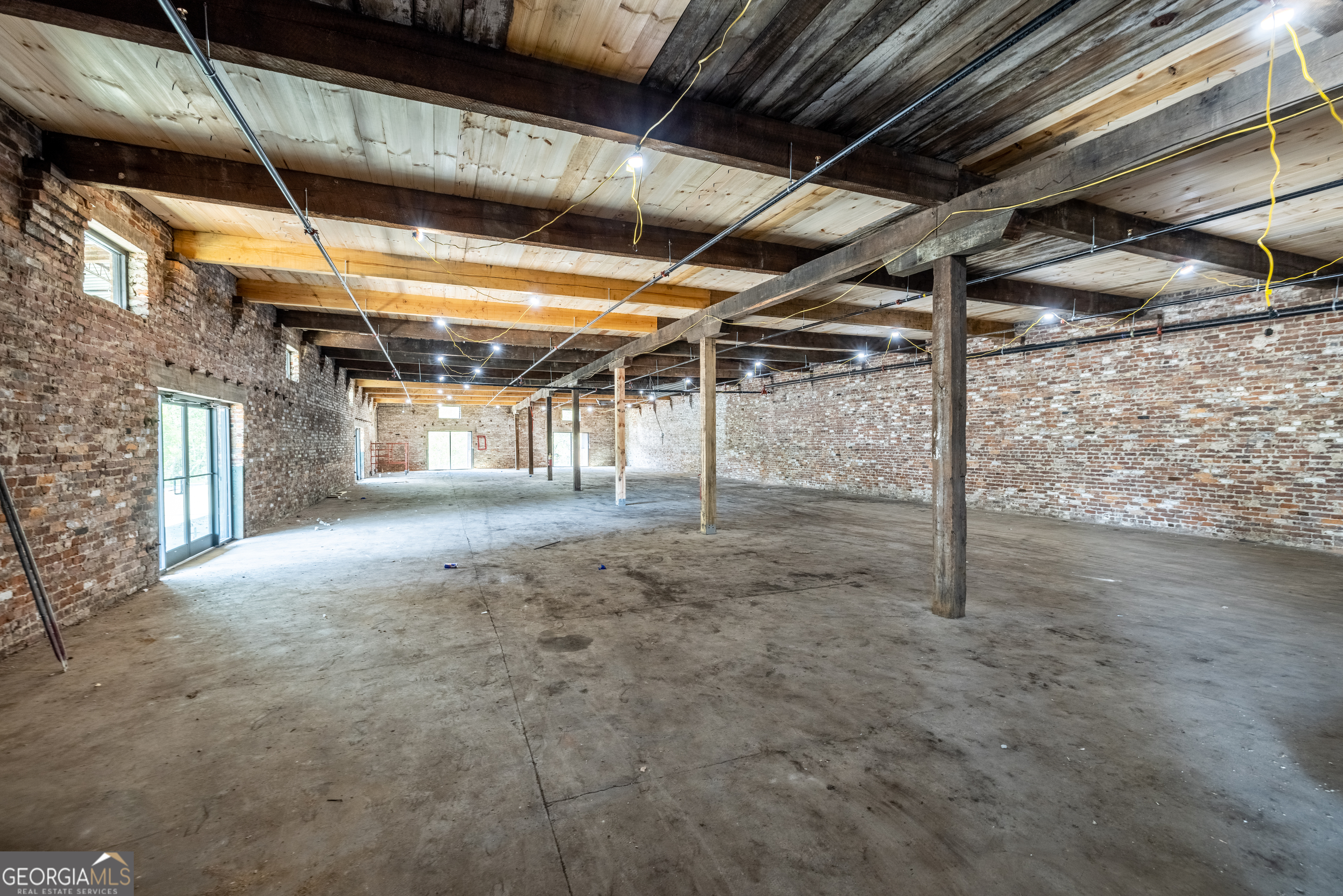 314 East 1st Avenue Rome, GA 30161 - Photo 12 of 16 a view of empty room with wooden ceiling